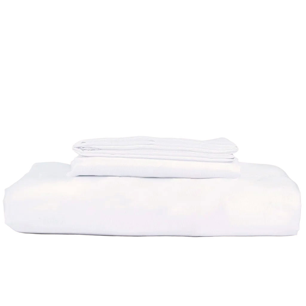 White bed sheets stacked on a white background
