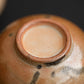 Detail image of the bottom of a tea cup.