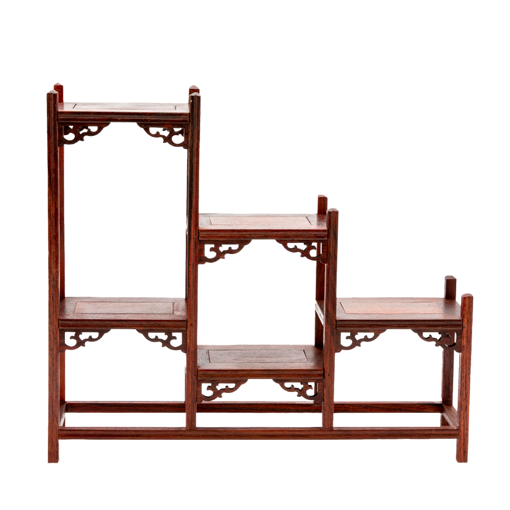 A traditional Japanese ornate rosewood shelf with scroll detailing and a stagnated 'step' design.