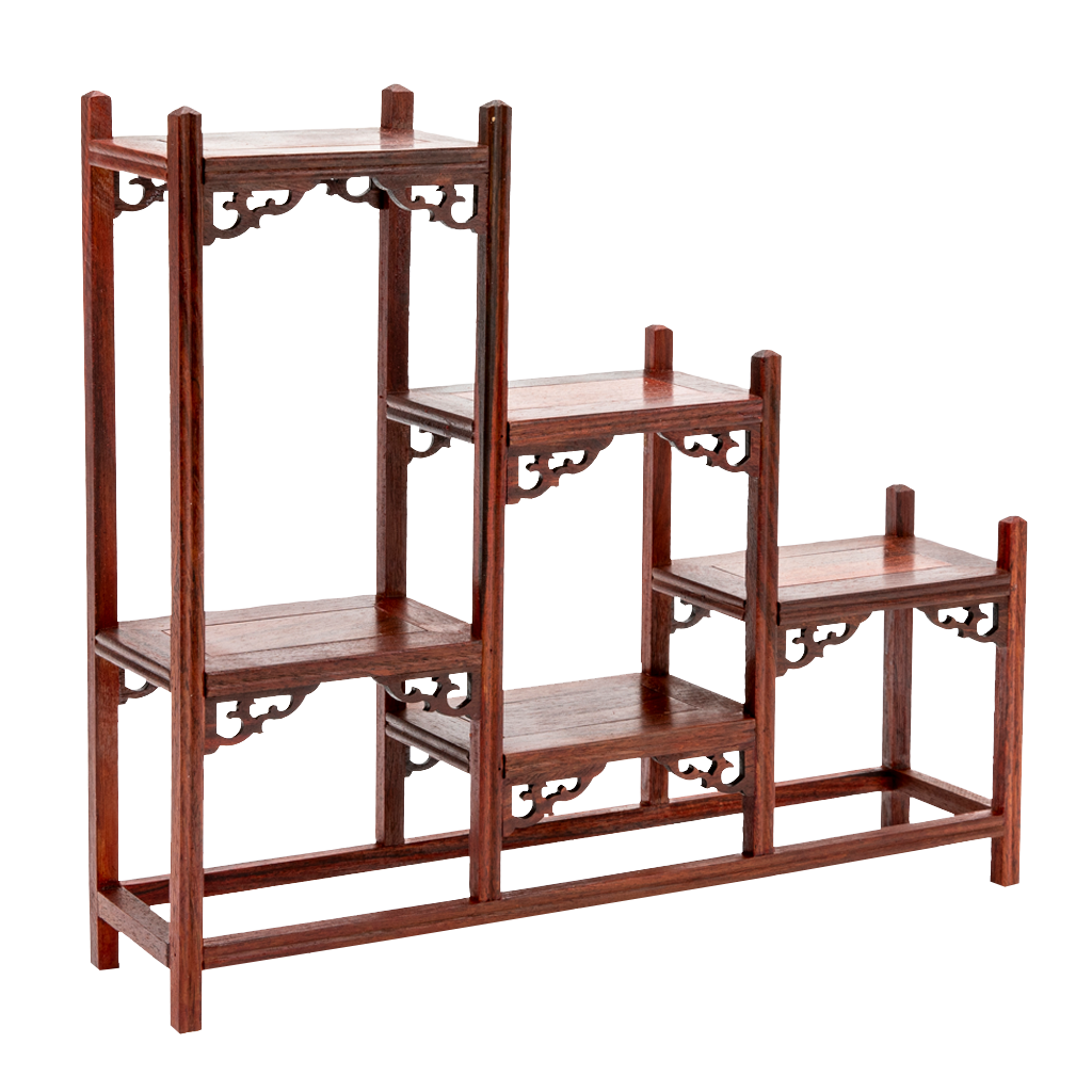 A traditional Japanese ornate rosewood shelf with scroll detailing and a stagnated 'step' design.