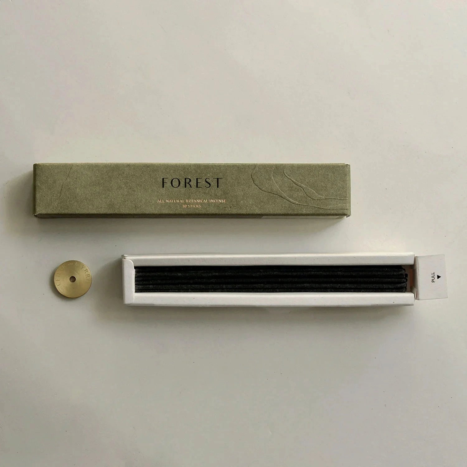 White electronic device with 'FOREST' branding on a beige background