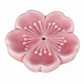 A pink cherry blossom-shaped ceramic incense holder with a central hole, featuring a glossy finish and white embossed petal details, set against a plain white background.