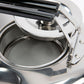 Close-up of a silver teapot with open lid