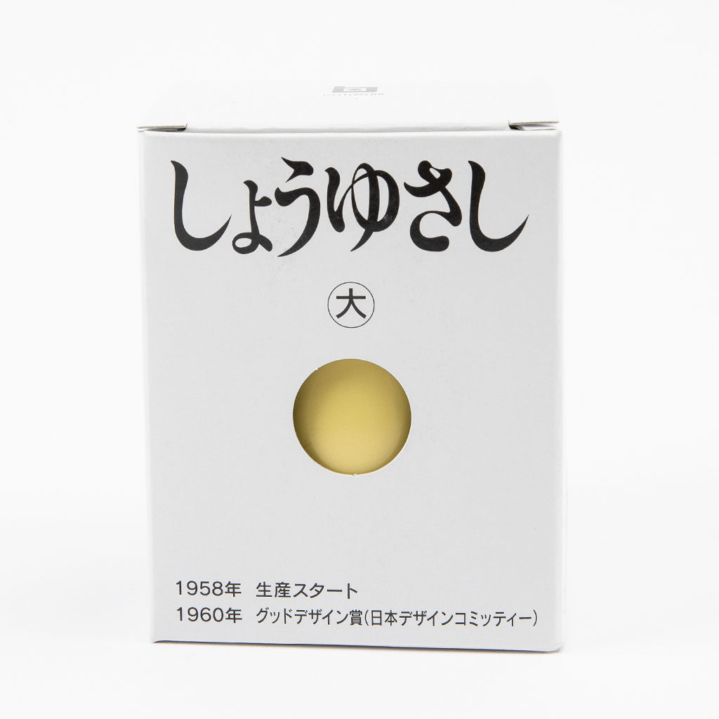 Soy sauce box with Japanese text and a yellow circle on a white background
