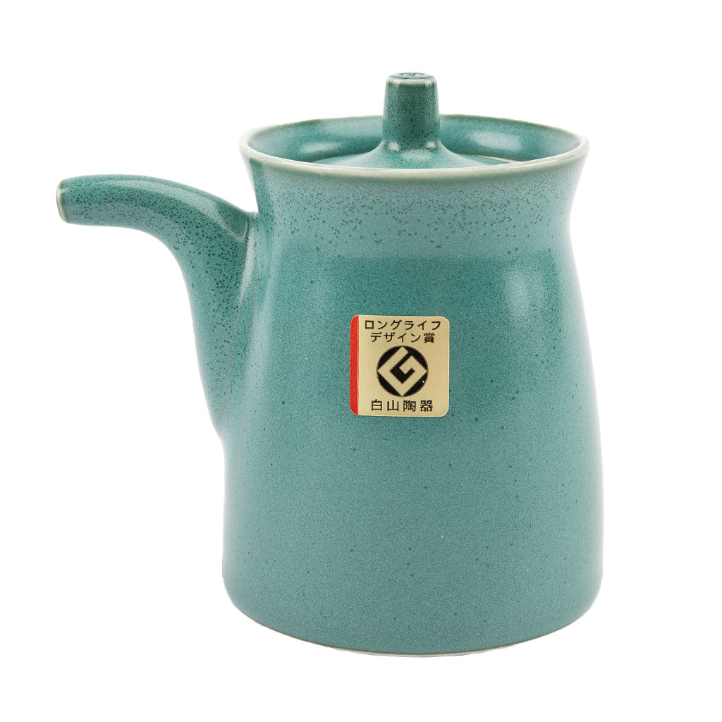 Teal ceramic soy sauce dispenser with a brand label on a white background