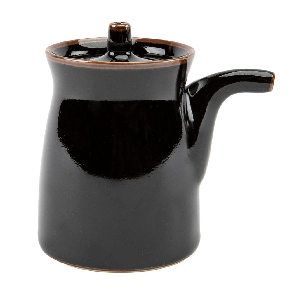 Black ceramic soy sauce dispenser on a white background