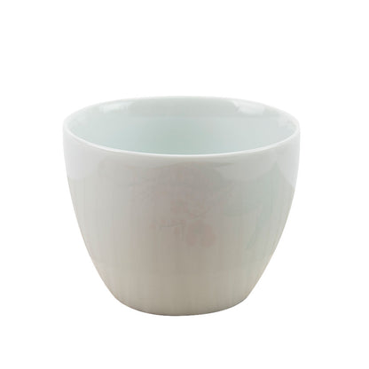 White ceramic cup on a white background