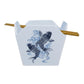 A white square chopstick holder with a blue koi fish and wave graphic on the front, shown with two wooden chopsticks resting in the top slots, against a plain white background.