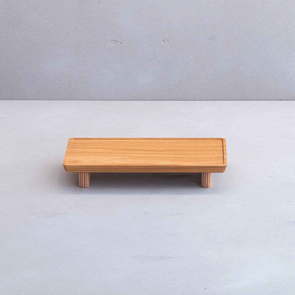 Wooden bench on a light gray background