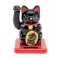 Black cat figurine with red base on white background