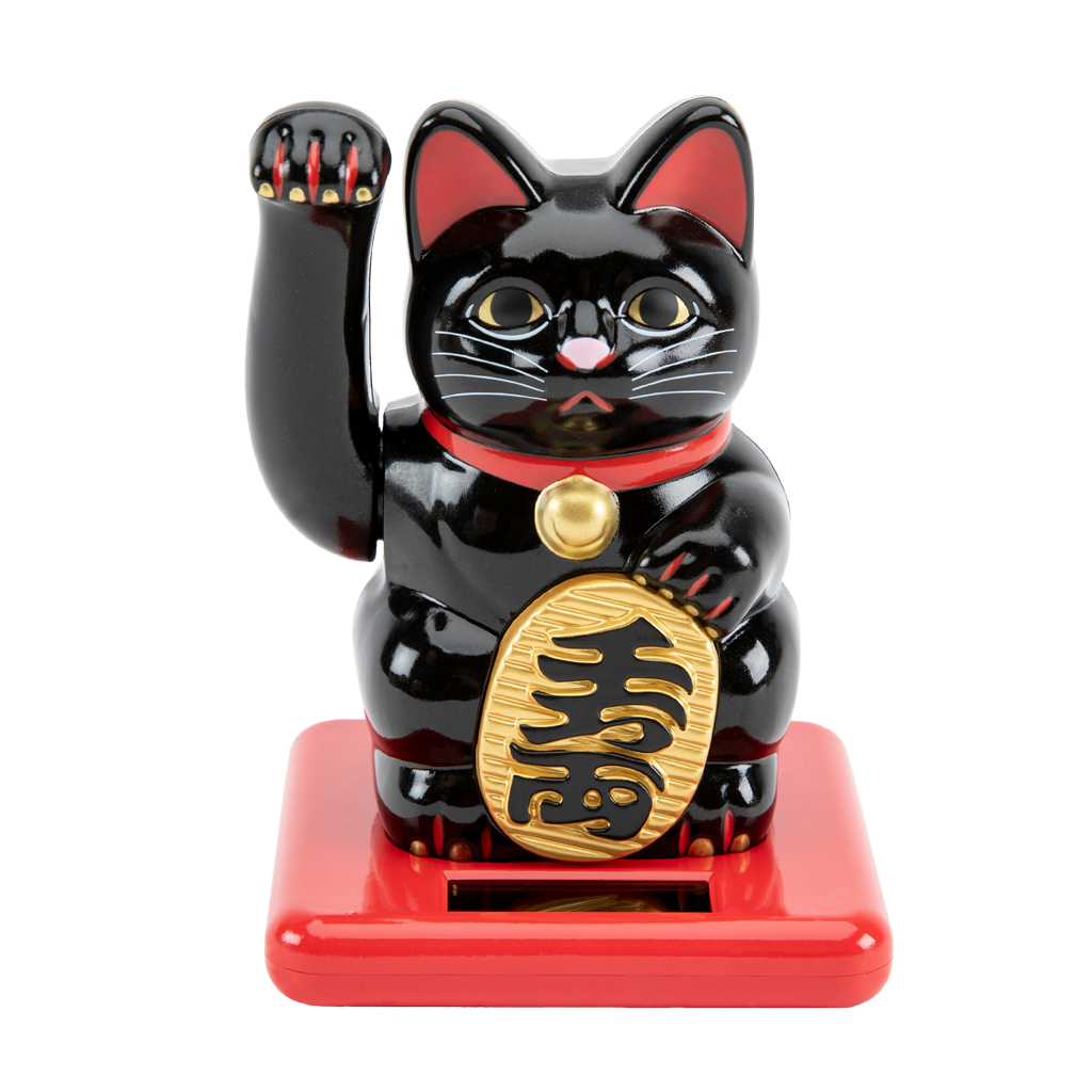 Black cat figurine with red base on white background