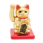 Gold maneki-neko cat on a red base with a white background