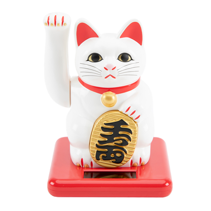 White cat figurine with red accents and gold emblem on a white background