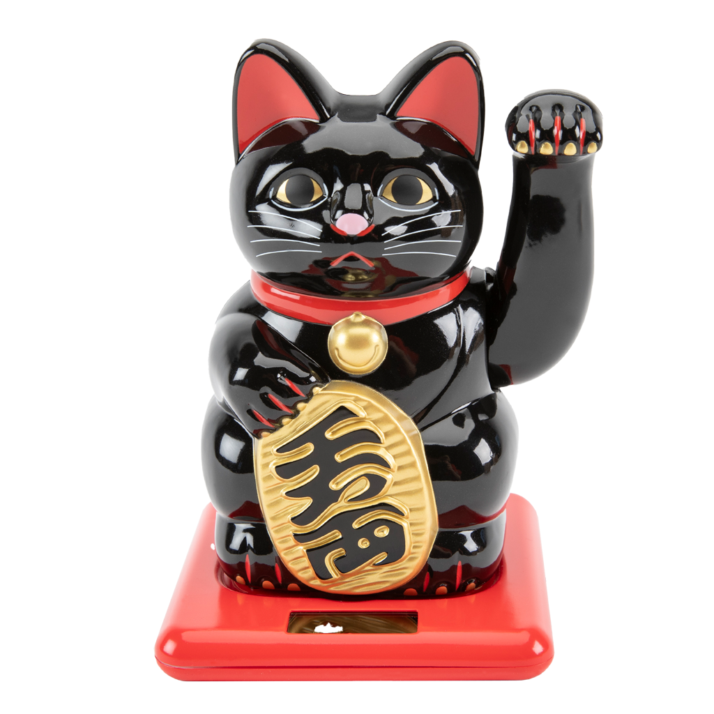 Black cat figurine with red base on white background