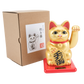 Gold maneki-neko cat on a red base with a white background