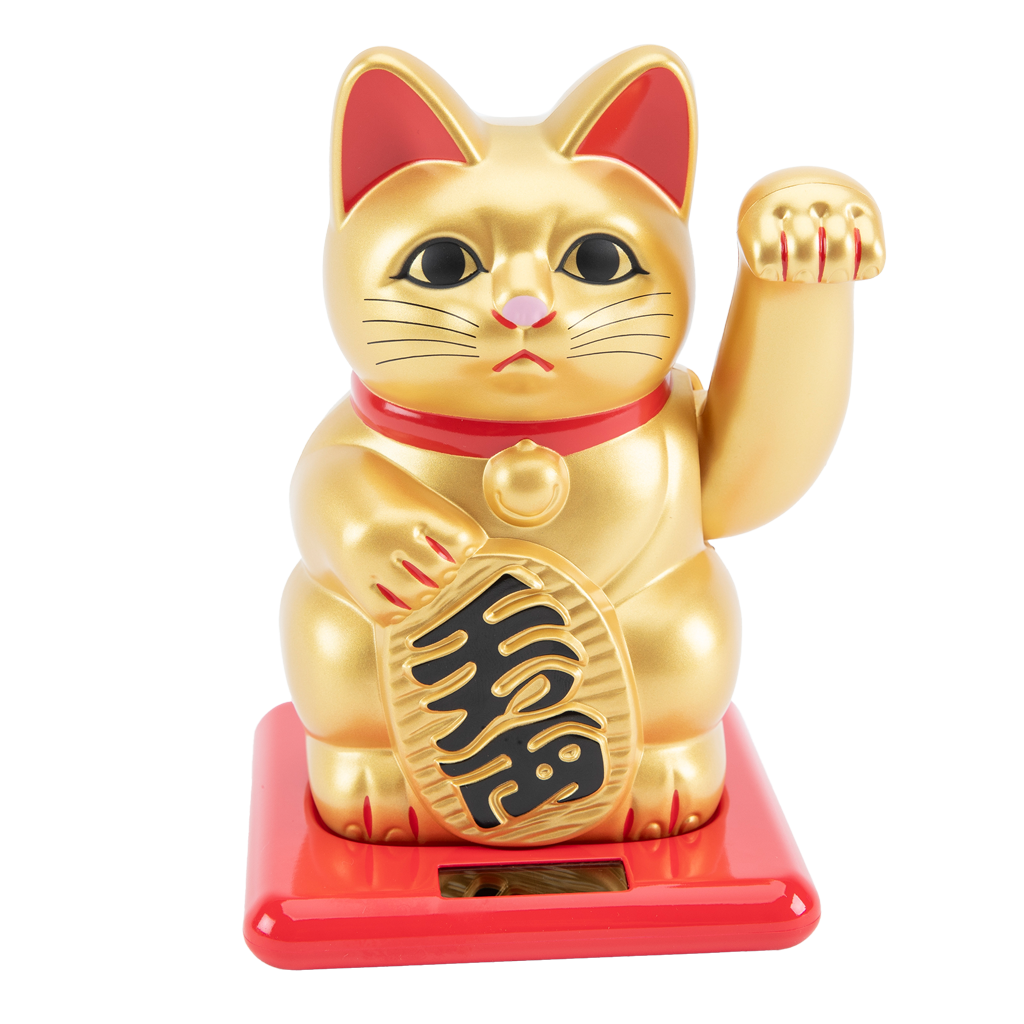 Gold cat figurine with red base on white background