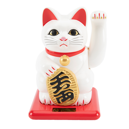 White cat figurine with red accents and gold pendant on a white background