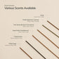 Incense sticks with labels for various scents on a beige background