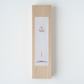 Wooden box with a small painting on a white background