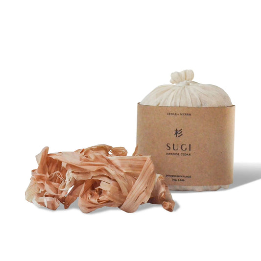 Bamboo skewers with a SUGI branded paper bag on a white background
