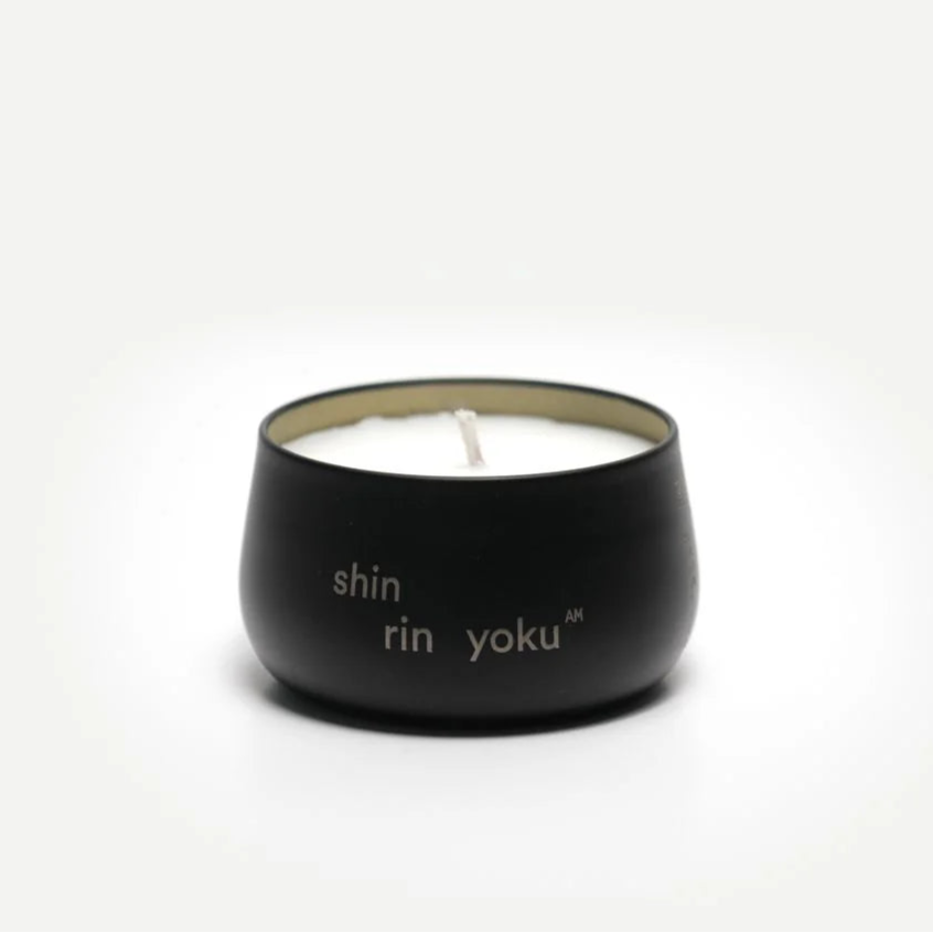 Black candle holder with 'shin rin yoku' text on a white background