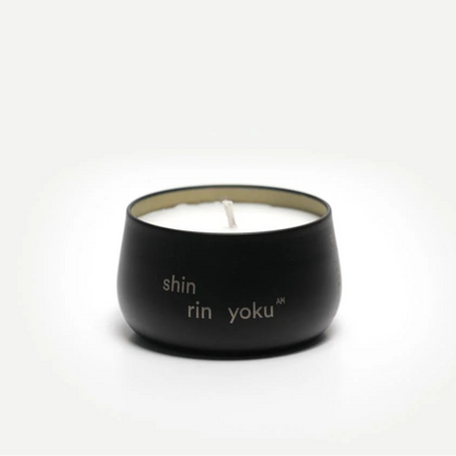 Black candle holder with 'shin rin yoku' text on a white background