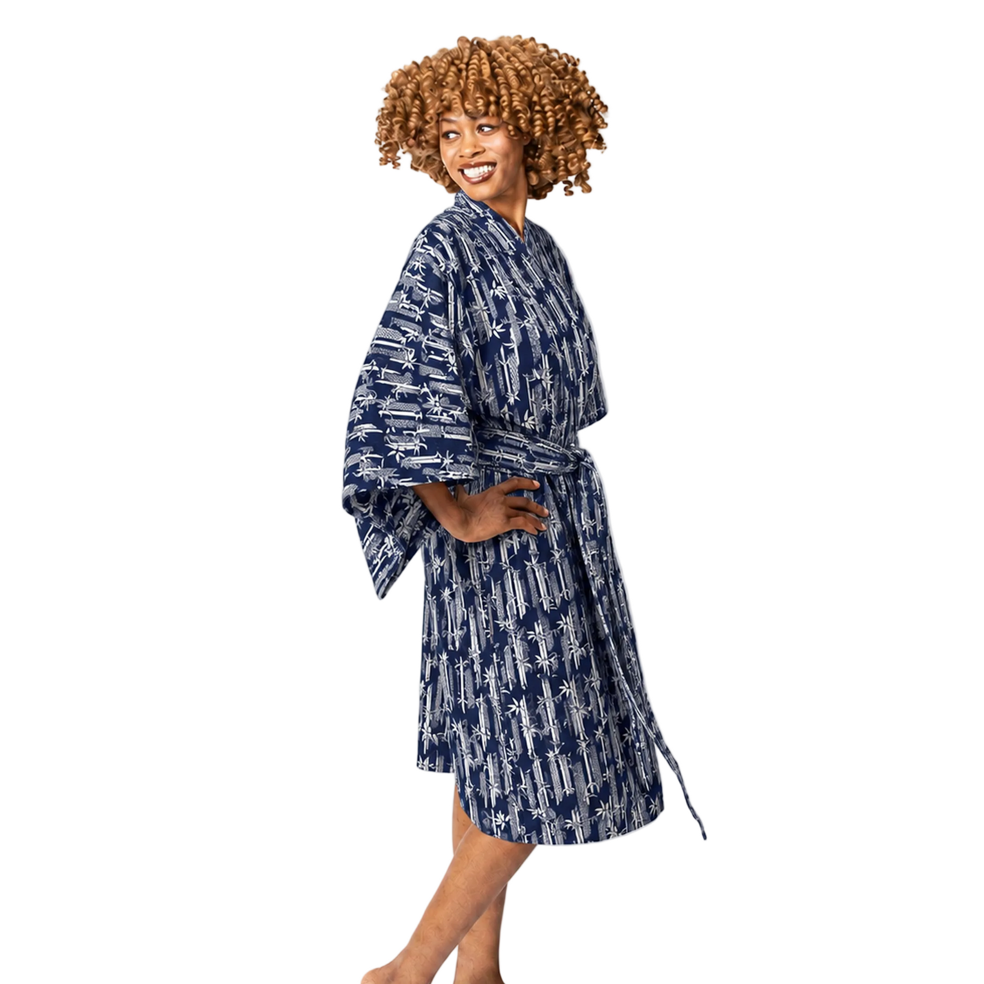 A woman modeling a navy blue and white patterned bathrobe against a plain white studio background.
